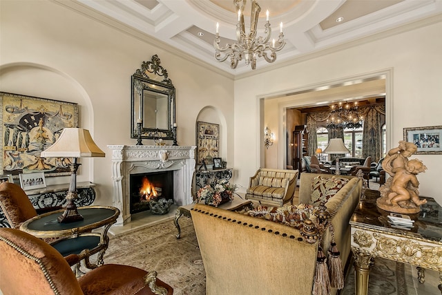 living room with coffered ceiling, a fireplace, ornamental molding, and an inviting chandelier