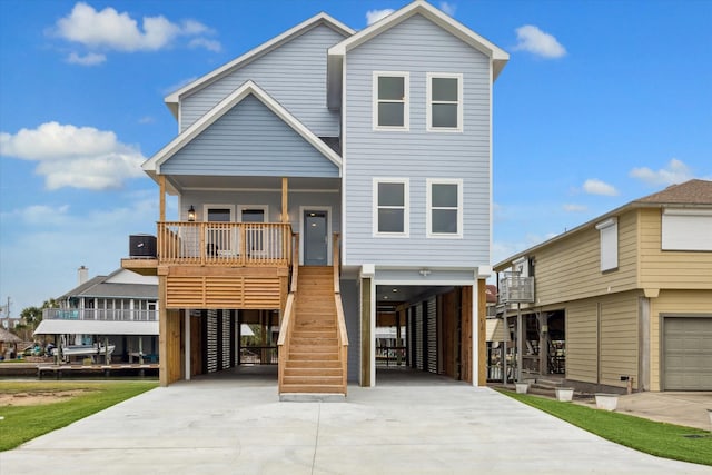 view of front of house with central AC and a carport