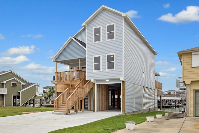 back of house featuring a carport