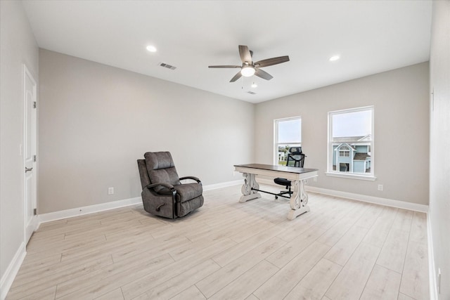 office area with ceiling fan and light hardwood / wood-style flooring