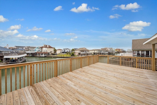 wooden deck featuring a water view