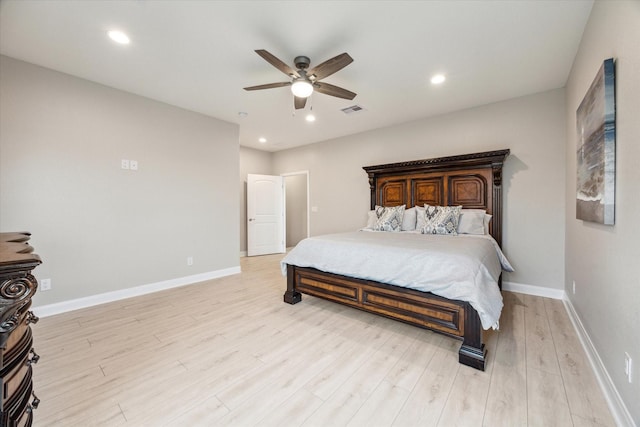 bedroom with ceiling fan and light hardwood / wood-style floors