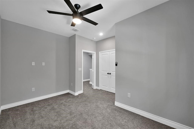 carpeted empty room with ceiling fan