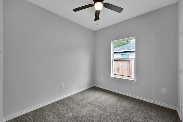 empty room with ceiling fan and carpet floors