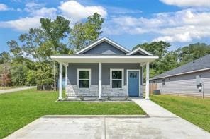 view of front of property with a front lawn and a porch