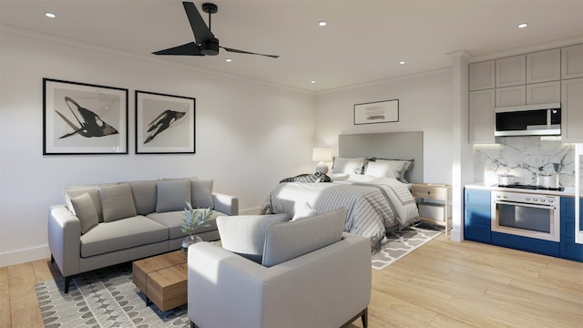 bedroom with ornamental molding, light hardwood / wood-style floors, and ceiling fan