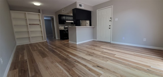 unfurnished living room with hardwood / wood-style floors