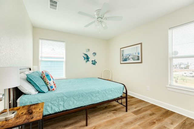 bedroom featuring ceiling fan and light hardwood / wood-style flooring