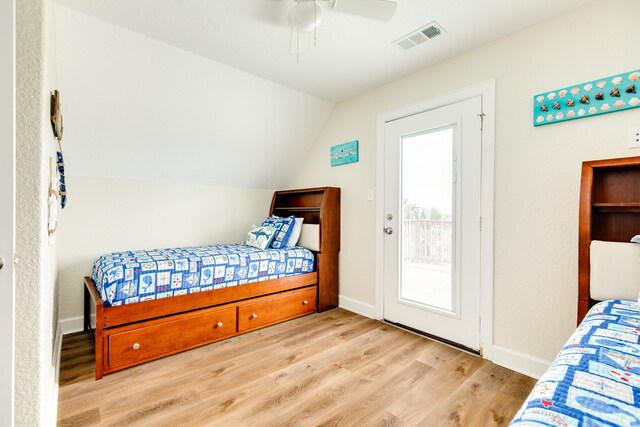 bedroom with lofted ceiling, ceiling fan, light hardwood / wood-style flooring, and access to outside