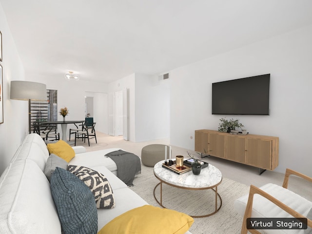 living room featuring light carpet