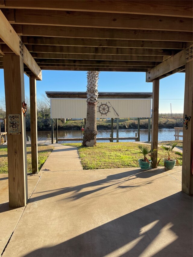 view of patio with a water view