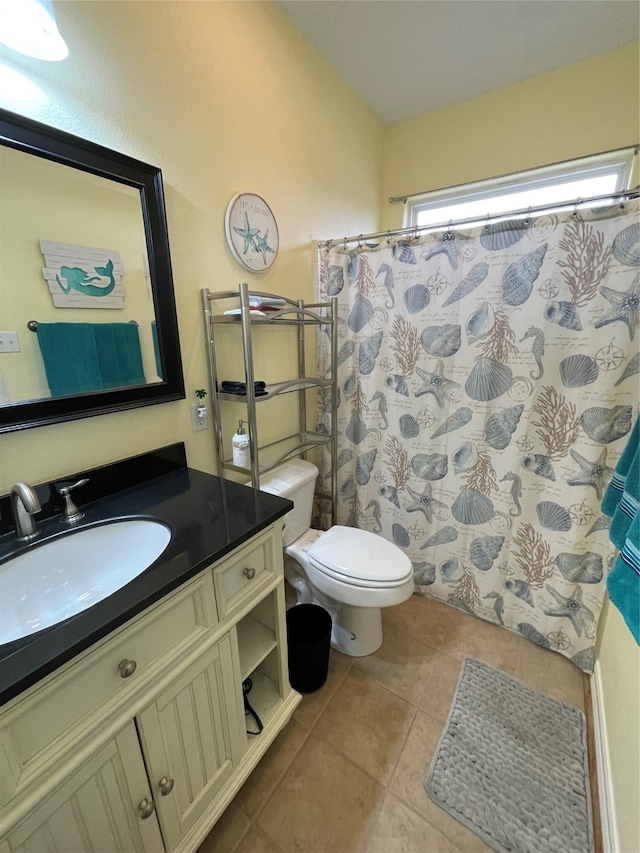 bathroom featuring vanity, tile patterned flooring, toilet, and a shower with shower curtain