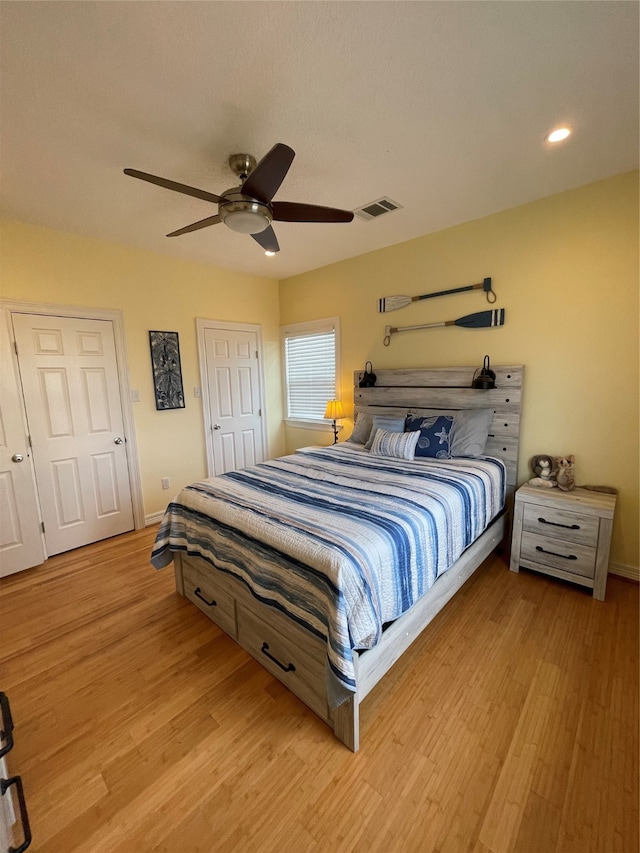 bedroom featuring ceiling fan and light wood-type flooring