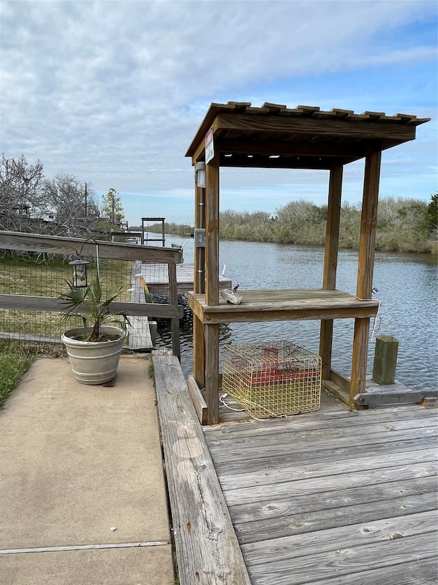 dock area featuring a water view