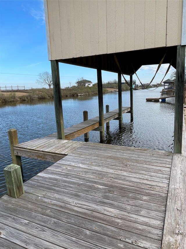 dock area featuring a water view