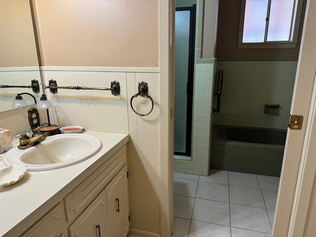 713 Sarah Jo St, La Grange, TX 78945 - bathroom with a shower with shower door, vanity, wainscoting, and tile patterned floors