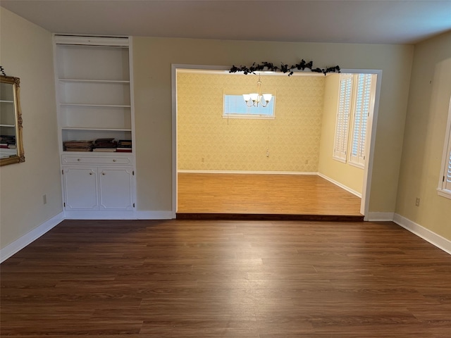 interior space with an inviting chandelier and hardwood / wood-style flooring