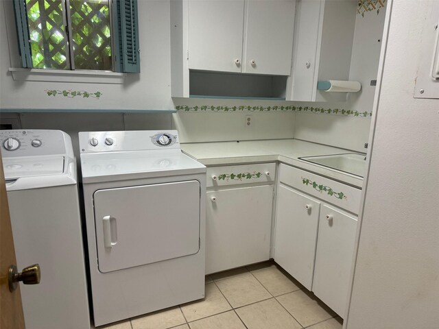 713 Sarah Jo St, La Grange, TX 78945 - laundry room with cabinet space, independent washer and dryer, and light tile patterned flooring