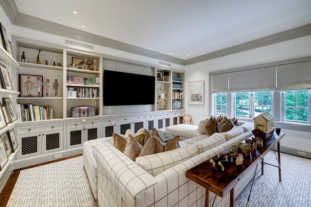 living room featuring built in features, light hardwood / wood-style floors, and ornamental molding