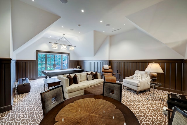 interior space with high vaulted ceiling and light carpet