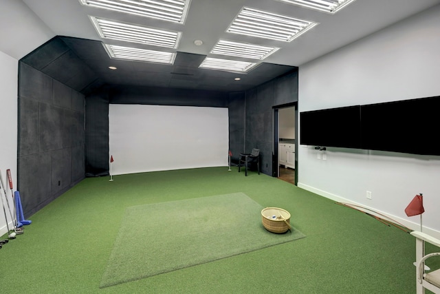 rec room featuring golf simulator and carpet flooring