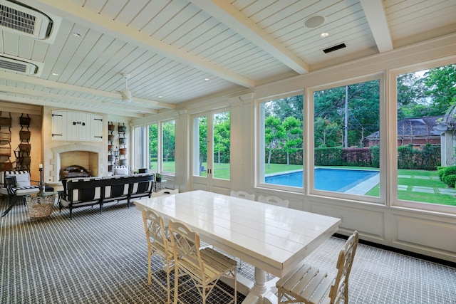 sunroom / solarium with beamed ceiling