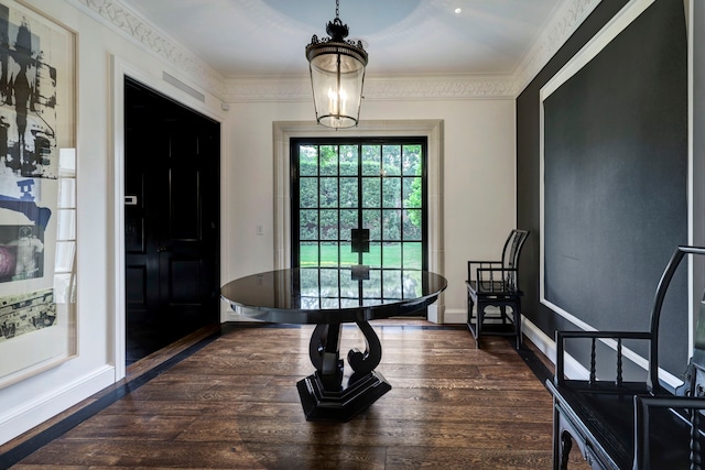 interior space featuring dark hardwood / wood-style flooring and ornamental molding