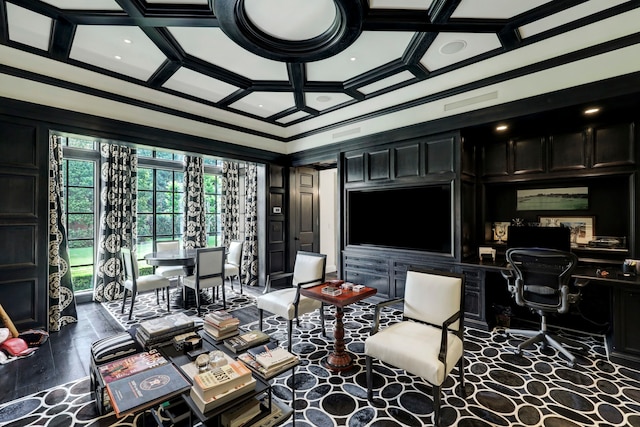 living room featuring coffered ceiling, built in desk, and ornamental molding