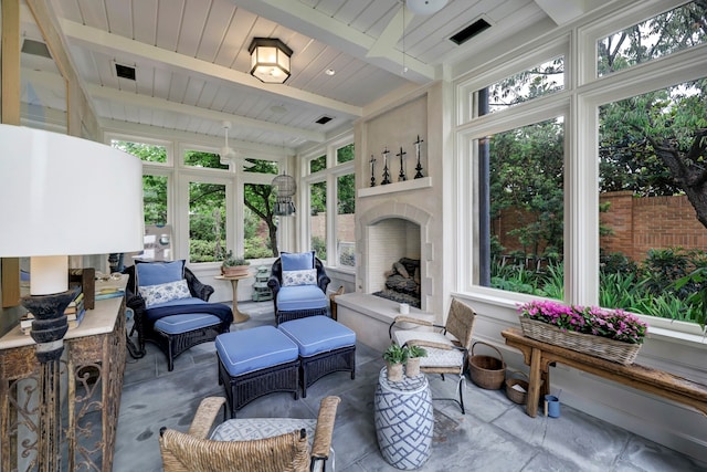 sunroom / solarium with beam ceiling and wooden ceiling