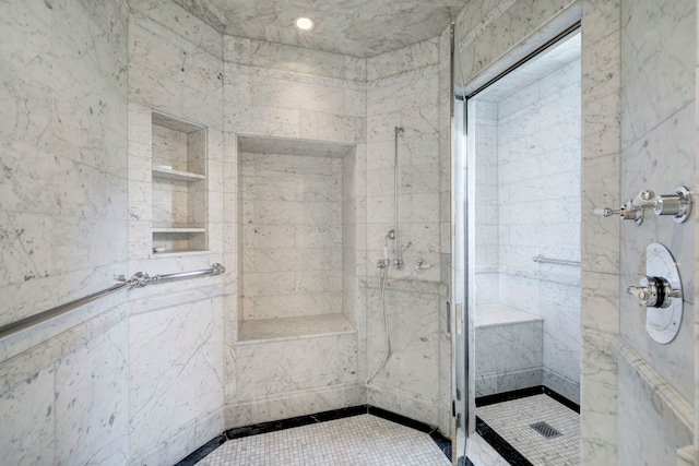 bathroom with tiled shower