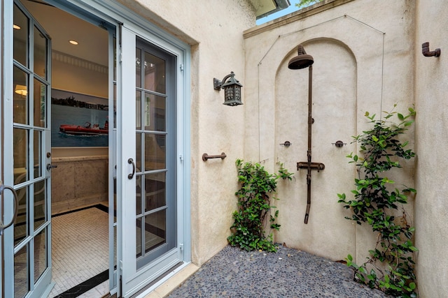 property entrance featuring french doors