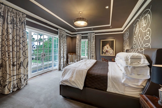 bedroom featuring carpet floors, access to outside, crown molding, a tray ceiling, and french doors