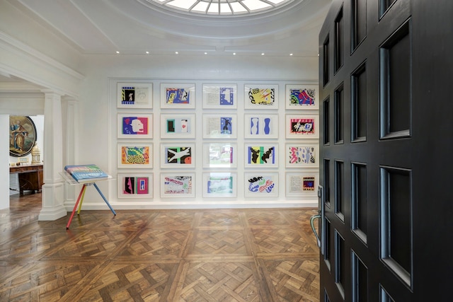 interior space featuring dark parquet floors and ornate columns