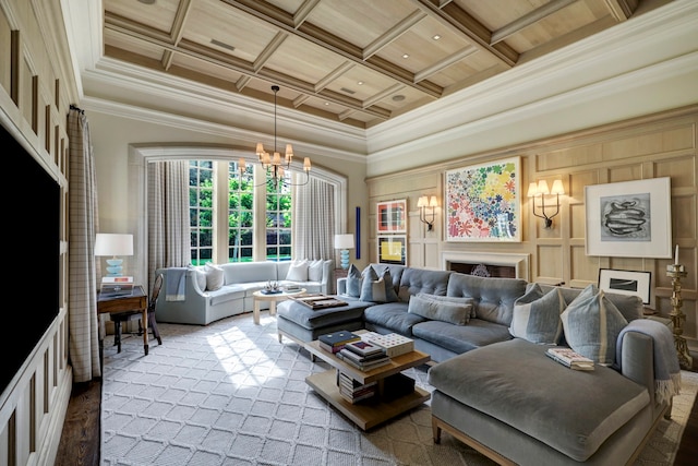 living room featuring beamed ceiling, coffered ceiling, a chandelier, crown molding, and a high ceiling