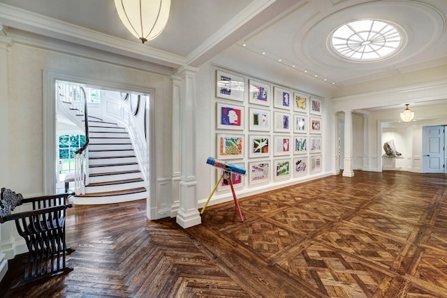 interior space with dark parquet flooring and ornate columns