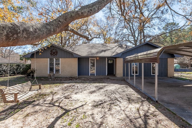 ranch-style home featuring a carport