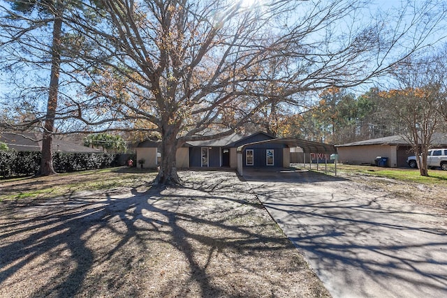 ranch-style house with a carport