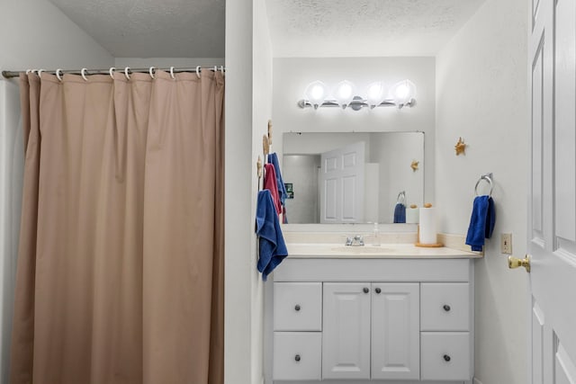 bathroom featuring vanity and a textured ceiling