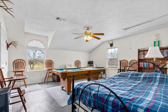 bedroom featuring ceiling fan, a textured ceiling, pool table, and vaulted ceiling