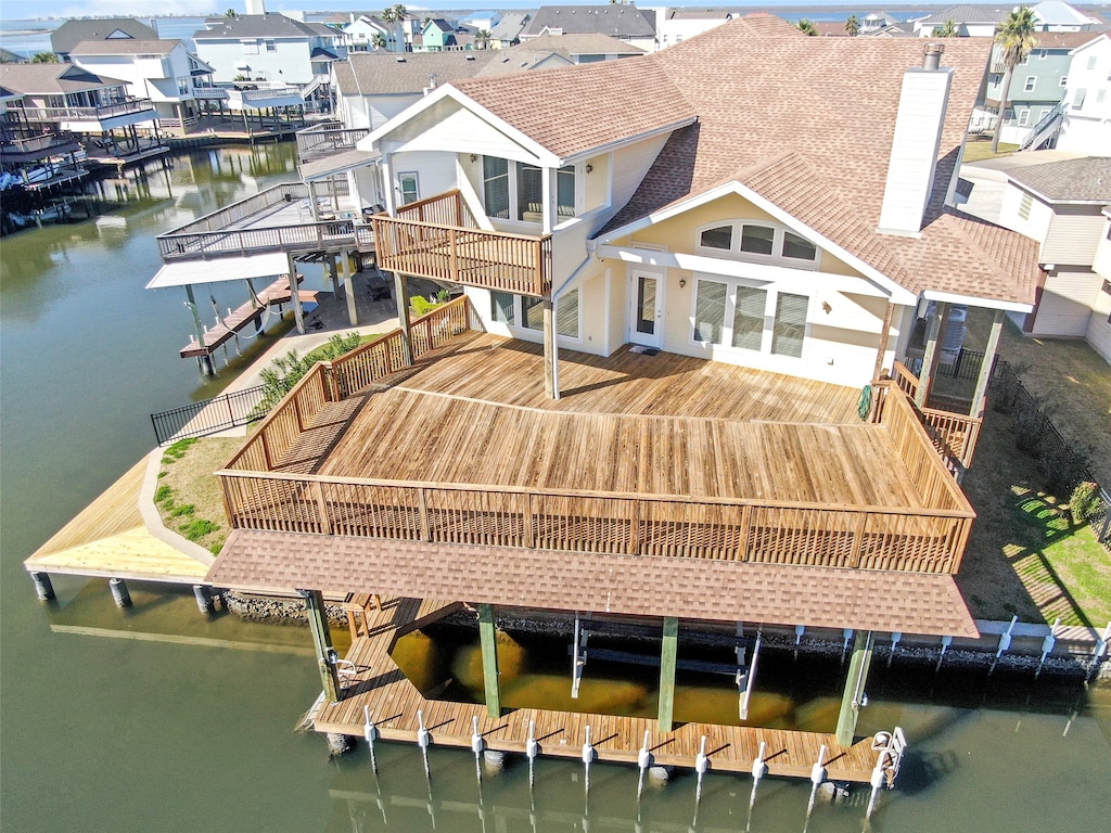 back of house featuring a water view