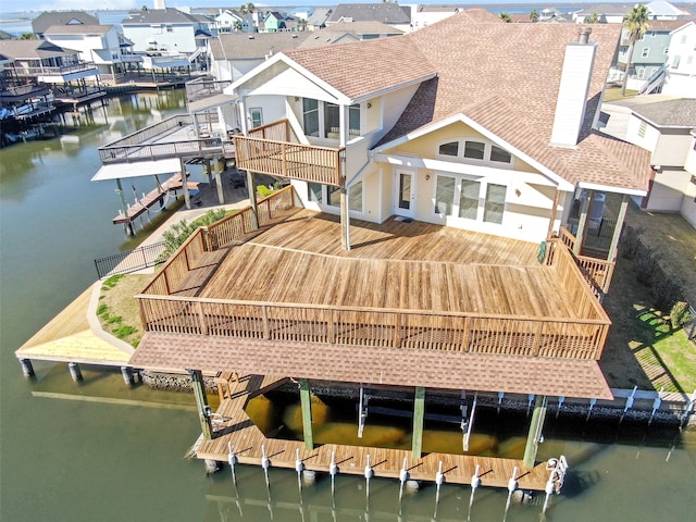 back of house featuring a water view