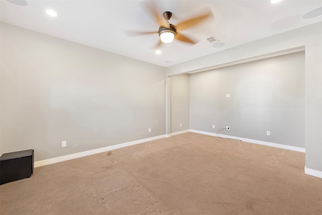 spare room with ceiling fan and carpet floors