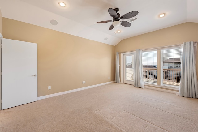 carpeted empty room featuring ceiling fan and lofted ceiling