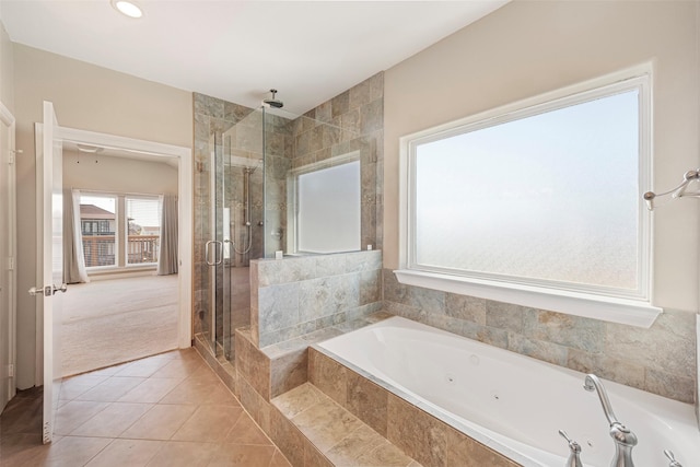 bathroom featuring shower with separate bathtub and tile patterned floors