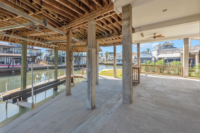 view of patio / terrace with a water view and a dock