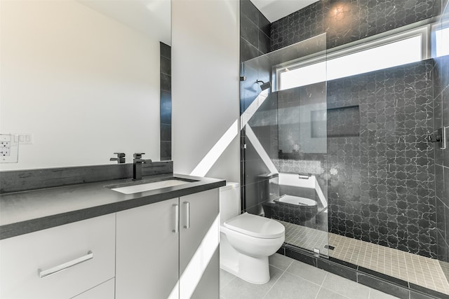 bathroom featuring tile patterned floors, vanity, toilet, and an enclosed shower