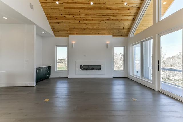 unfurnished living room featuring dark wood-type flooring, high vaulted ceiling, and wooden ceiling