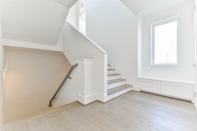 stairs with hardwood / wood-style floors