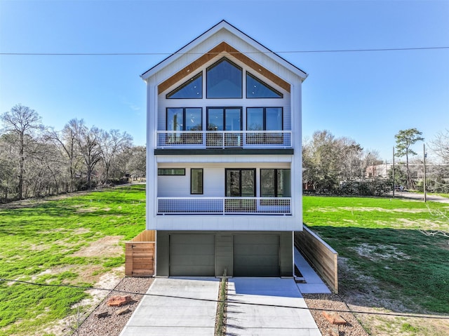 view of front facade with a garage and a front yard