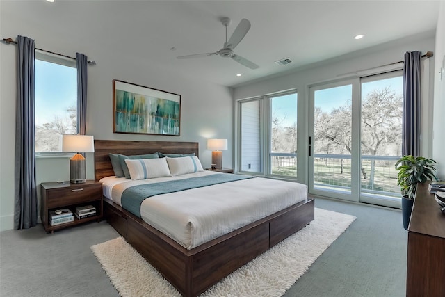 bedroom with ceiling fan, light colored carpet, and access to outside